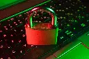 red padlock on black computer keyboard